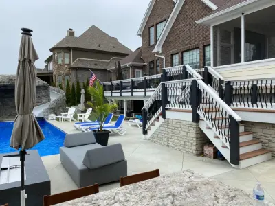 Tailored deck with a view of the stunning pool by DeckThisOut