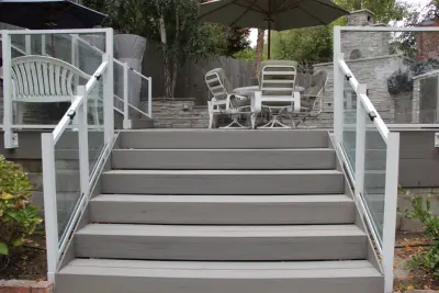 Contemporary Two-Tier Deck Featuring Custom Fireplace and Grill Area by Arroyo Grande Deck And Fence