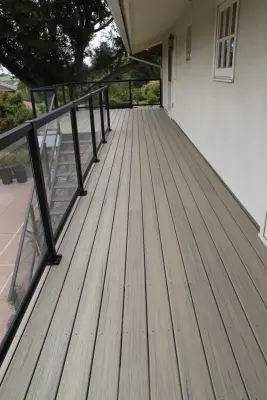 Effortless Composite Deck with Black-Framed Glass Railing — Deck Building & Repair project by Arroyo Grande Deck And Fence