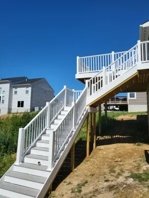 20x12 Composite Deck with Custom Two-Tier Steps and White Fascia Wrap — Deck Building & Repair project by Jaguar Decks And Fences