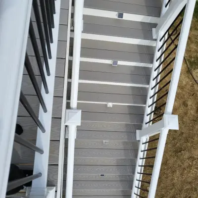 26x14 composite deck featuring white PVC railings and black aluminum spindles — Deck Building & Repair project by Jaguar Decks And Fences