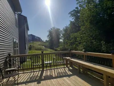Custom 12x16 White Pine Deck with Bench and Black Aluminum Railings — Deck Building & Repair project by Jaguar Decks And Fences