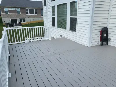 24x16 Composite Deck with Switchback Stairs and White Fascia Trim — Deck Building & Repair project by Jaguar Decks And Fences