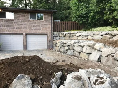 Rock retaining walls — Landscape Construction project by S R S Enterprises LLC