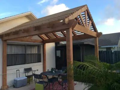 Pitched roof cedar pergola — Deck Building & Repair project by DeckThisOut