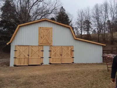 Custom Barn Doors — Deck Building & Repair project by American Fence & Deck Of NWA