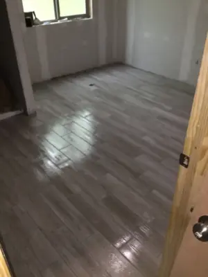 Weathered wood wainscoting bath tile deck — Deck Building & Repair project by Grand Deck Builders