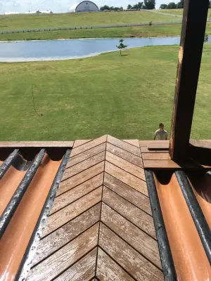 Stunning raised deck featuring Rain Escape for outdoor enjoyment below — Deck Building & Repair project by Lazo Pro Patios & Decks