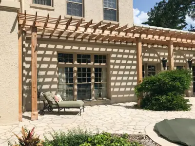 Charming Kansas Residence Featuring Pergola, Paver Patio, and Swimming Pool by Kansas City Hardscapes
