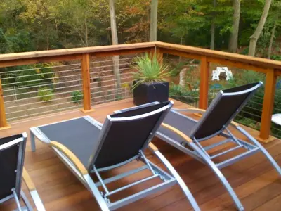 Epe decking featuring cable railing — Deck Building & Repair project by DeckThisOut