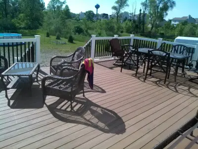 Layered deck with flowing stairs — Deck Building & Repair project by BKH Development, LLC