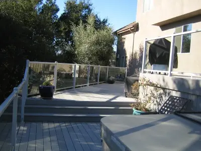 Glass Railing Composite Deck — Deck Building & Repair project by Tarantino's Yardscapes