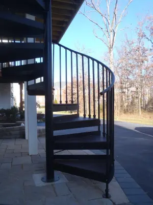 TREX Spiral Staircase Composite Deck — Deck Building & Repair project by Deckscapes Of VA, LLC
