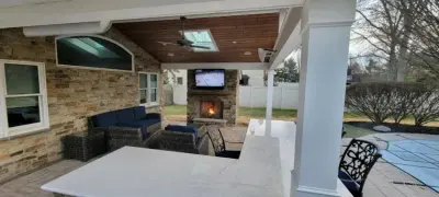 Patio Shelter with Fireplace and Outdoor Cooking Area — Deck Building & Repair project by Miles Deck Construction