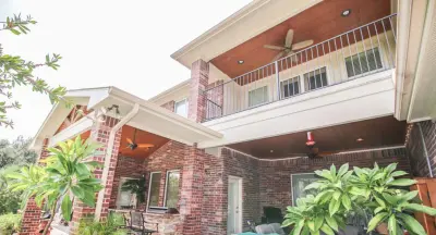 Cypress, TX Outdoor Kitchen with Covered Patio — Deck Building & Repair project by Tradition Outdoor Living