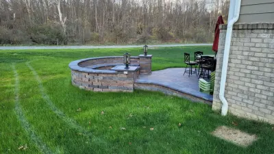Curved Patio Fire Pit with Integrated Bench Seating — Deck Building & Repair project by SelectDecks