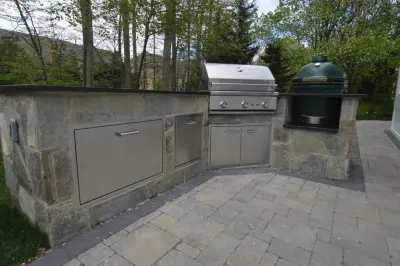 Bespoke Outdoor Living Space with Patio, Pergola, Seatwall, and Kitchen — Deck Building & Repair project by Deckscapes Of VA, LLC