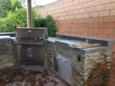 Tailored Stone Exterior Cooking Area — Deck Building & Repair project by Steel Support Systems