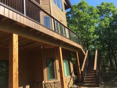 Deck featuring stainless steel cable railing — Deck Building & Repair project by Lazo Pro Patios & Decks
