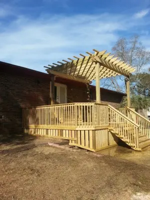 skirted deck with pergola — Deck Building & Repair project by Custom Southern Structures