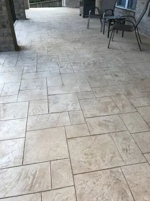 Sophisticated Stamped and Stained Decorative Concrete Overlay: San Antonio, TX — Deck Building & Repair project by Diamond Decks