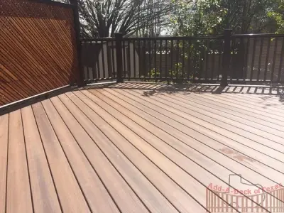 Tudor Brown Fiberon Decking and Antique Leuder Limestone Patio — Deck Building & Repair project by Austin Add-A-Deck