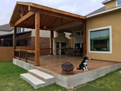 Gable Canopy with Ornamental Concrete Deck and Stoned Grill/Fireplace — Deck Building & Repair project by Diamond Decks