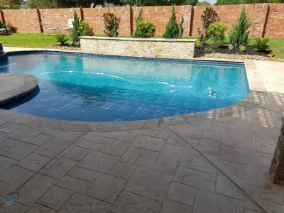 Curved Geometric Pool - Missouri City, Texas — Deck Building & Repair project by Bratton Pools