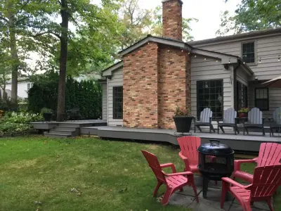 Gray Composite Back Deck with 25-Year Warranty by Deckorators — Deck Building & Repair project by Unique Deck Builders
