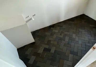 Herringbone Tile Flooring for the Bathroom — Deck Building & Repair project by American Stone & Timber, LLC