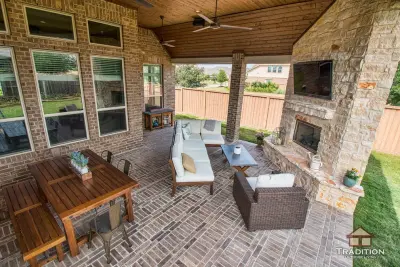 Elevated Patio Featuring Stone Fireplace in Katy, TX — Deck Building & Repair project by Tradition Outdoor Living