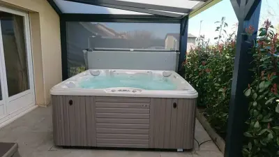 Backyard Minimalist Family Hot Tub — Deck Building & Repair project by Recreation Unlimited