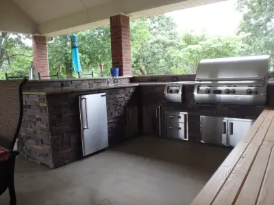 L-Shaped Outdoor Kitchen Featuring Distinctive Lighting — Deck Building & Repair project by Big Ridge Outdoor Kitchens, LLC