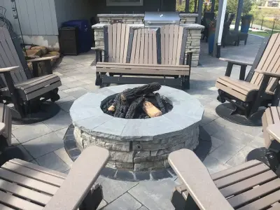 Expansive Kansas Paver Patio Featuring Fire Pit, Grill Area, and Basketball Court — Deck Building & Repair project by Kansas City Hardscapes