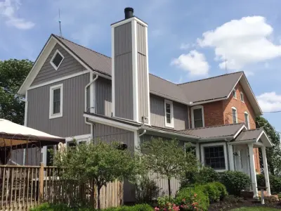 Harbor Gray Vinyl Siding with Mastic Board and Batten — Deck Building & Repair project by Ohio Exteriors
