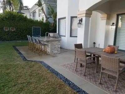 Contemporary L-shaped island in Pacific Palisades — Deck Building & Repair project by L.A. Custom Grill Islands