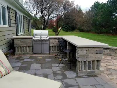 Tiered Patio with Outdoor Cooking Area and Fire Pit in Kildeer, IL — Deck Building & Repair project by Archadeck Of Chicagoland