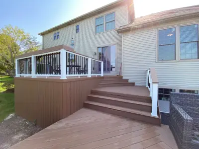Rustic Elm Multi-level TimberTech Deck with Floating Bench in Naperville, IL — Deck Building & Repair project by Archadeck Of Chicagoland