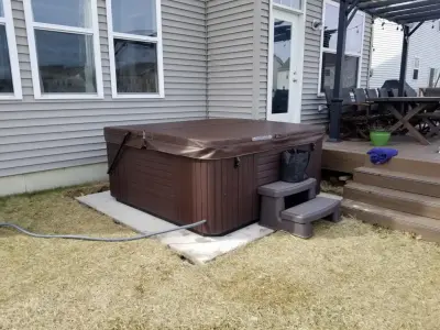Outdoor Spa with Concrete Platform — Deck Building & Repair project by Recreation Unlimited