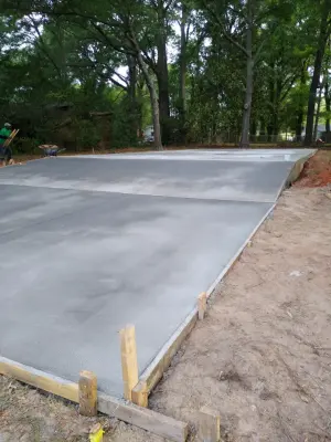 level surface illumination broom finish — Driveway Repair & Paving project by R & B Concrete Co.