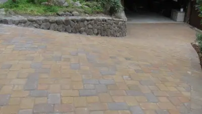Stone Retaining Wall with Paver Driveway — Driveway Repair & Paving project by Van Midde Concrete