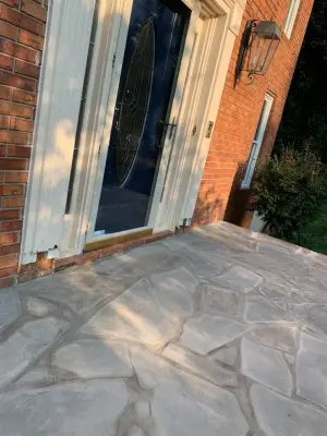 Installation of a stone patio by Gonzalez Construction Co