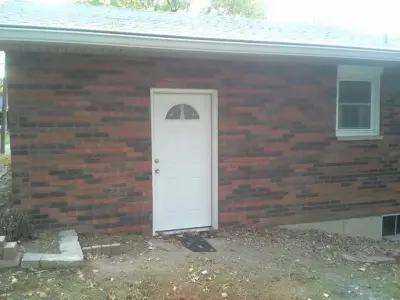 Garage Brick Reconstruction: Before and After by Masterpiece Masonry