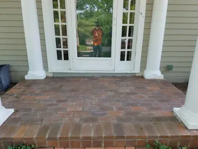 Kirkwood brick porch restoration and tuckpointing by Masterpiece Masonry