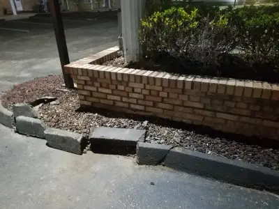 Planter and Brick Sign Renovation by Masterpiece Masonry