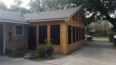 Cedar-Enclosed Porch — Stone & Concrete Installation project by Archadeck Of Southeast Louisiana