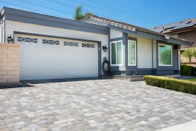 Pavers above Pebble Tec Coating — Stone & Concrete Installation project by Pavescapesinc