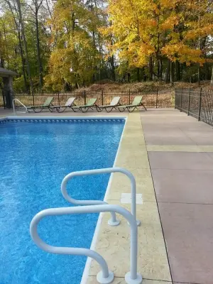 Swimming Pool Patios — Stone & Concrete Installation project by Custom Concrete Designs/Solidify Concrete Studios