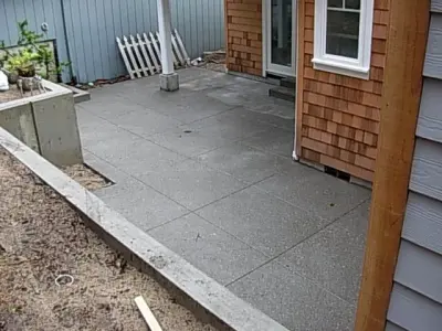 Schnider, Judy and Merv / Outdoor Features: Patio, Steps, and Retaining Wall — Stone & Concrete Installation project by Clatsop Concrete