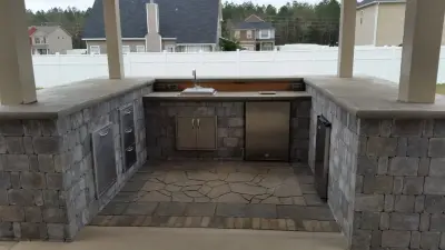 Outdoor Kitchen Expansion with Coverage | Sumter, SC — Stone & Concrete Installation project by Tranquil Escapes LLC
